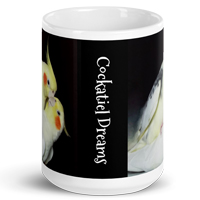 cup with Cockatiel Dreams vertically in white on black curly type
